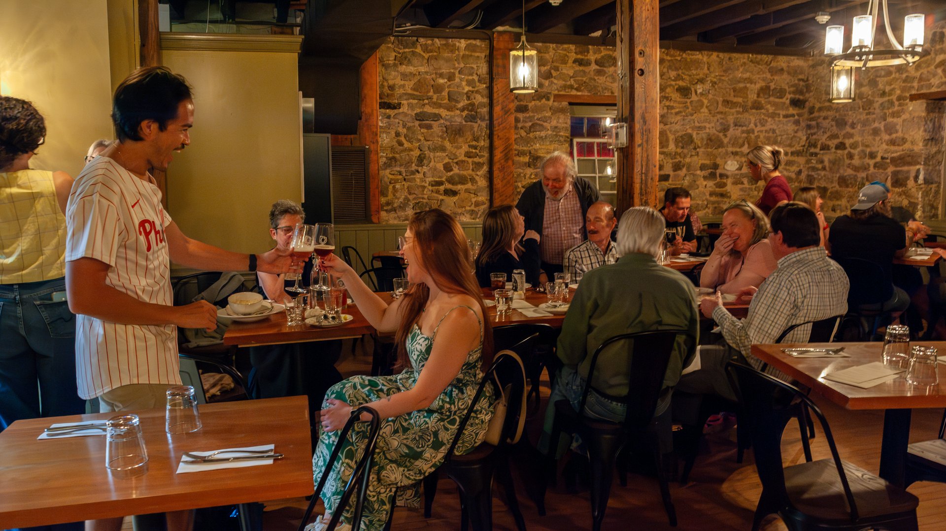 Guests eating and toasting in the Concordance Ferments dining room